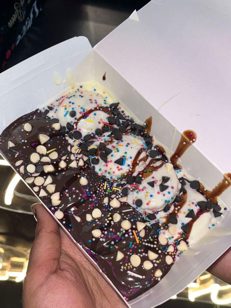 Close-up of premium mini pancakes with dark and white chocolate and colorful sprinkles